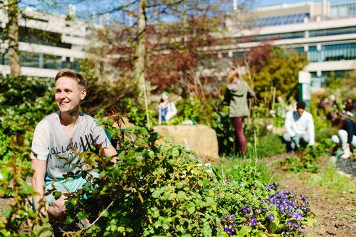 student in sustainability garden