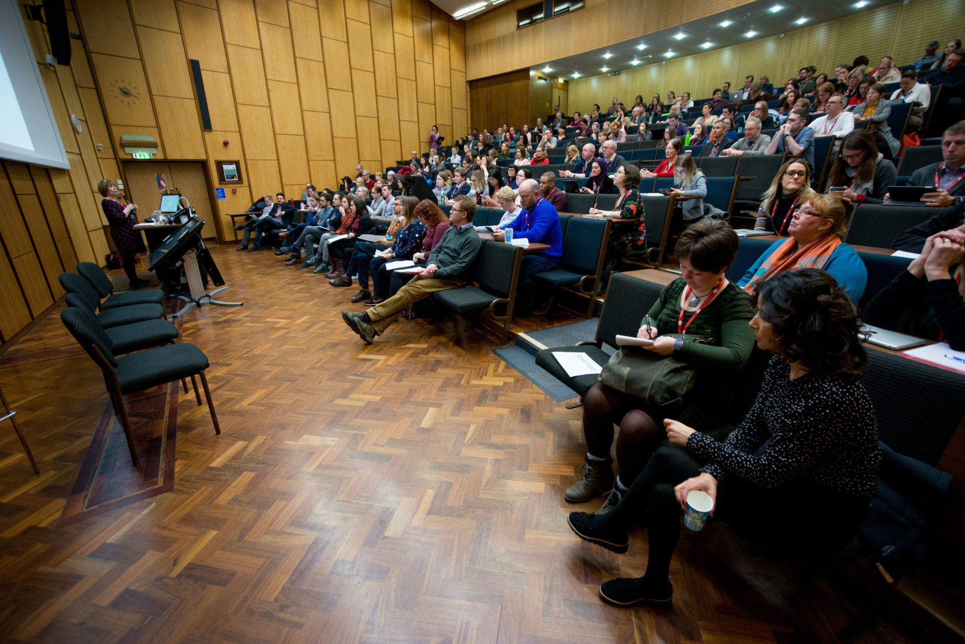 Speaker and delegates in a lecture theatre from the student education conference